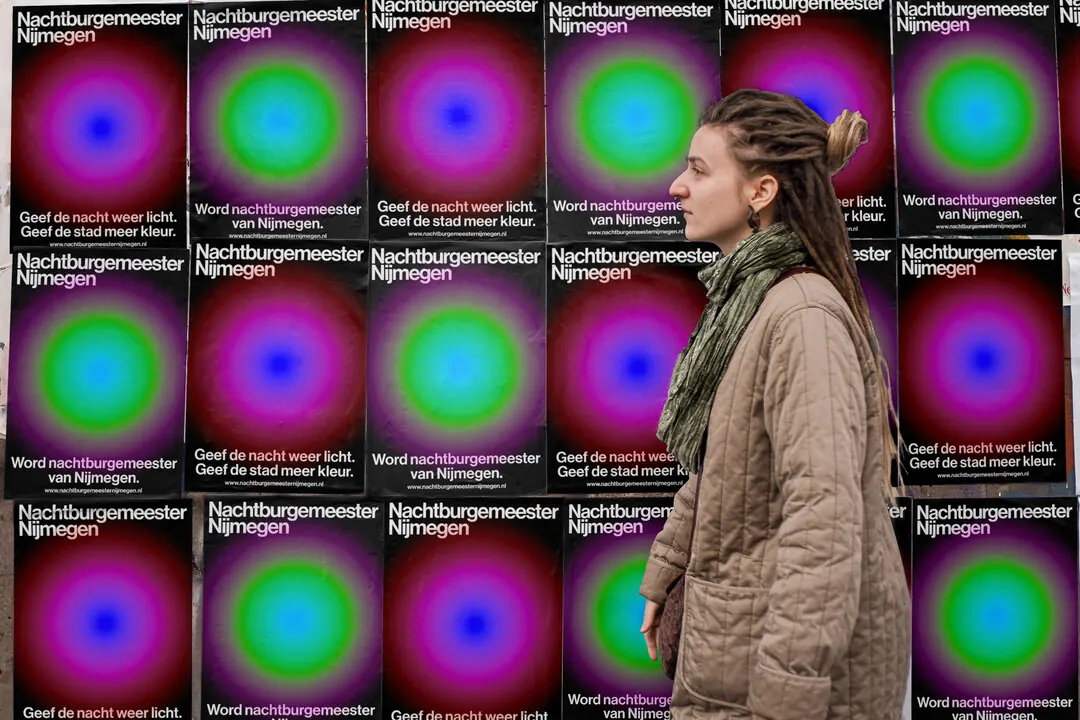 A wall of posters with glowing circular gradients